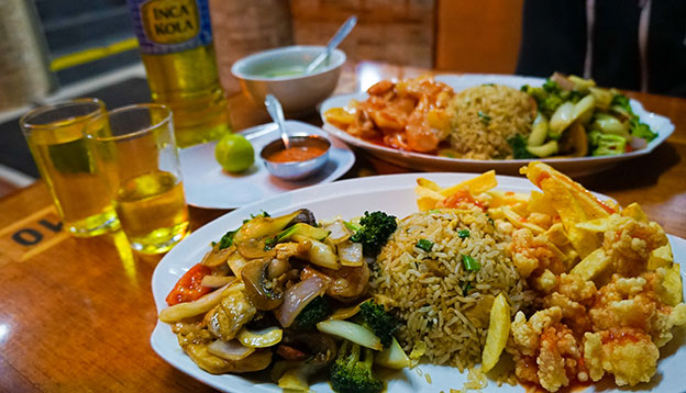 A table of traditional Chifa food in Lima