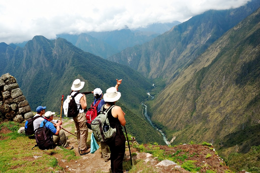 Hikers the Inca Trail in Peru with mountains in the background