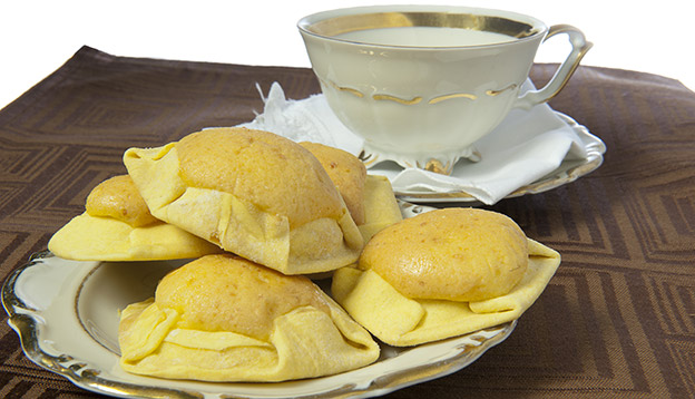 A plate of quesadillas in Ecuador served with coffee