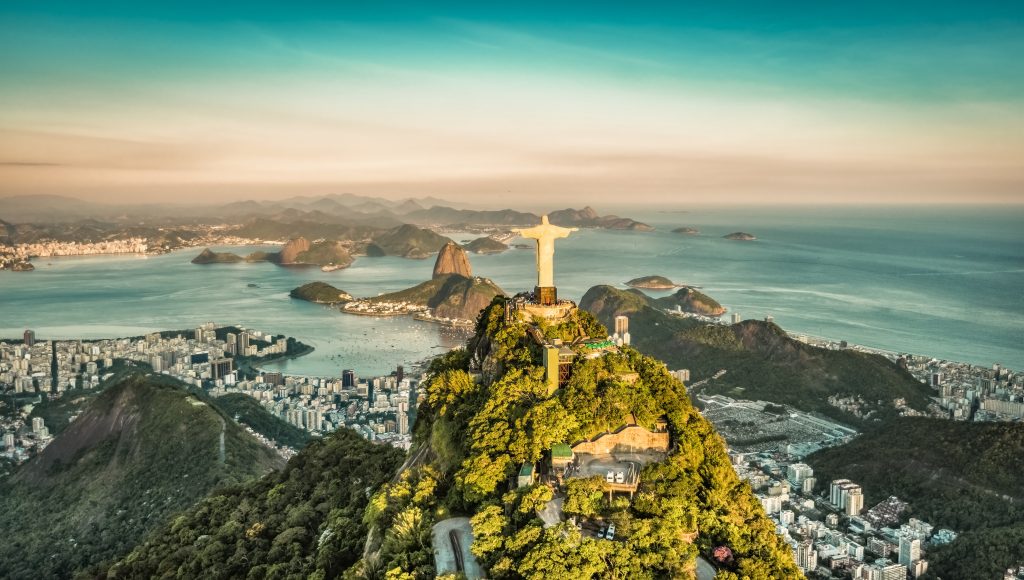 statue of rio and aerial view over the city of rio with the sea in the background