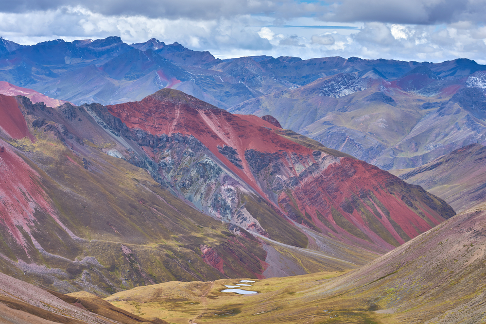 Walking on a trail up to the Rainbow Mountains. 